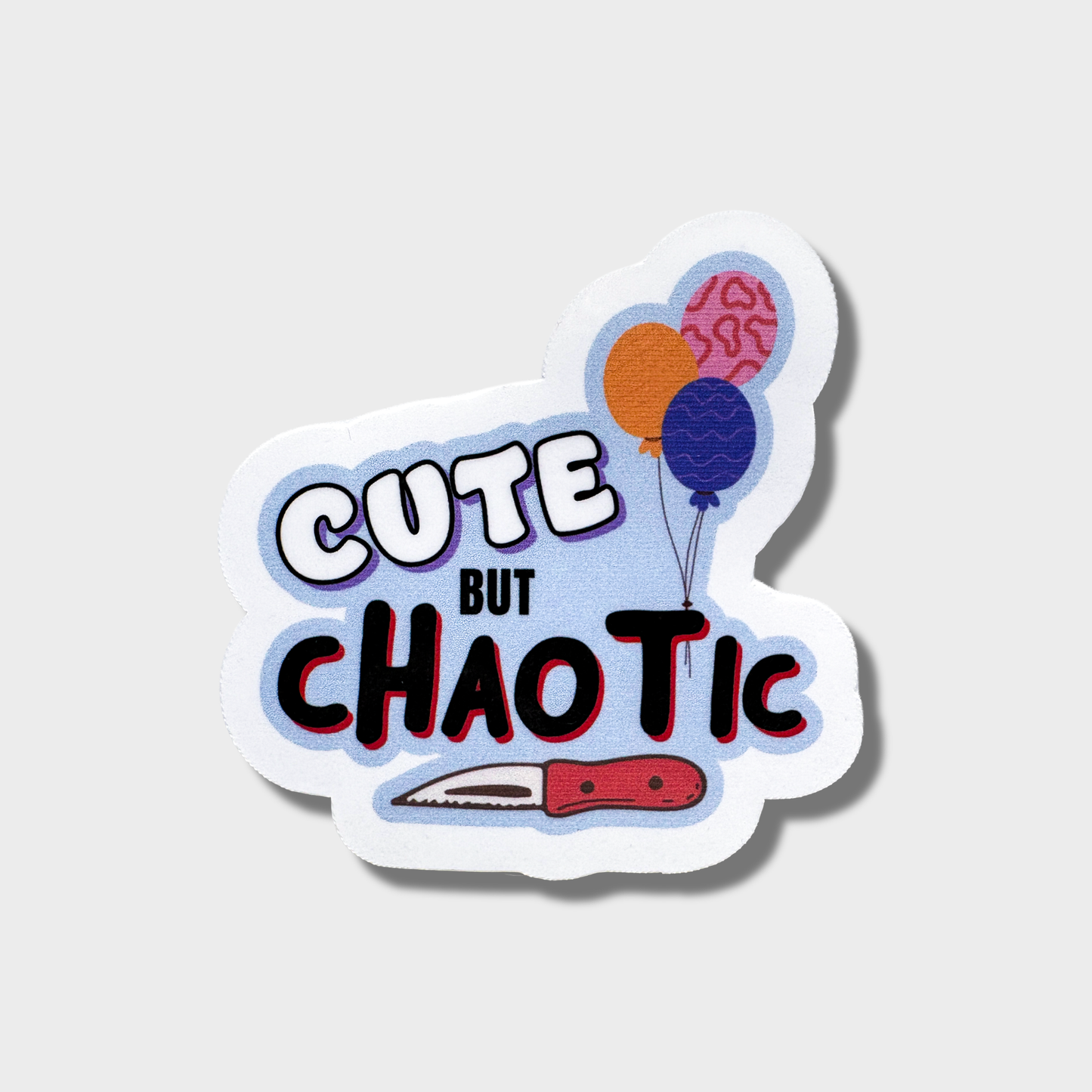 Sticker with 'Cute But Chaotic' text with a cartoon knife and balloons on a light blue background