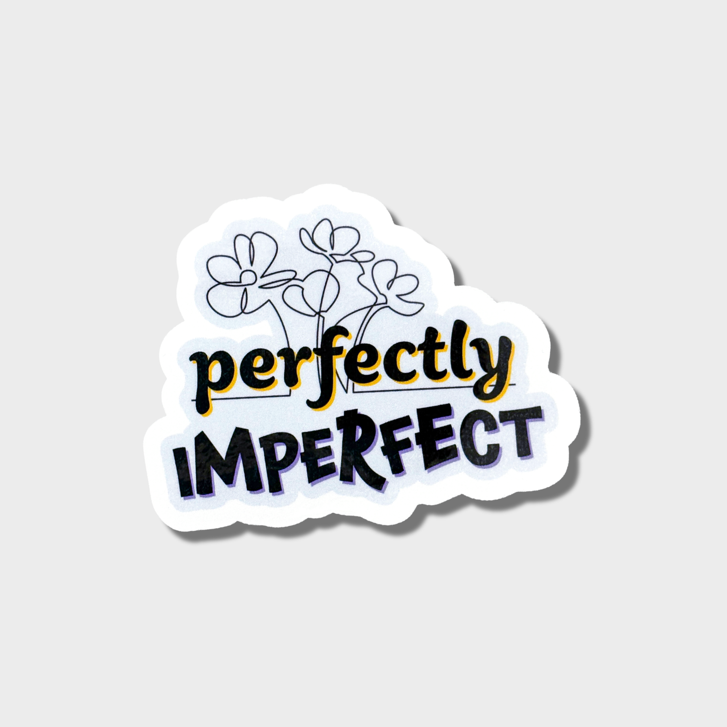 This sticker has the words "Perfectly imperfect" along with some messy line drawn flowers on a light blue background