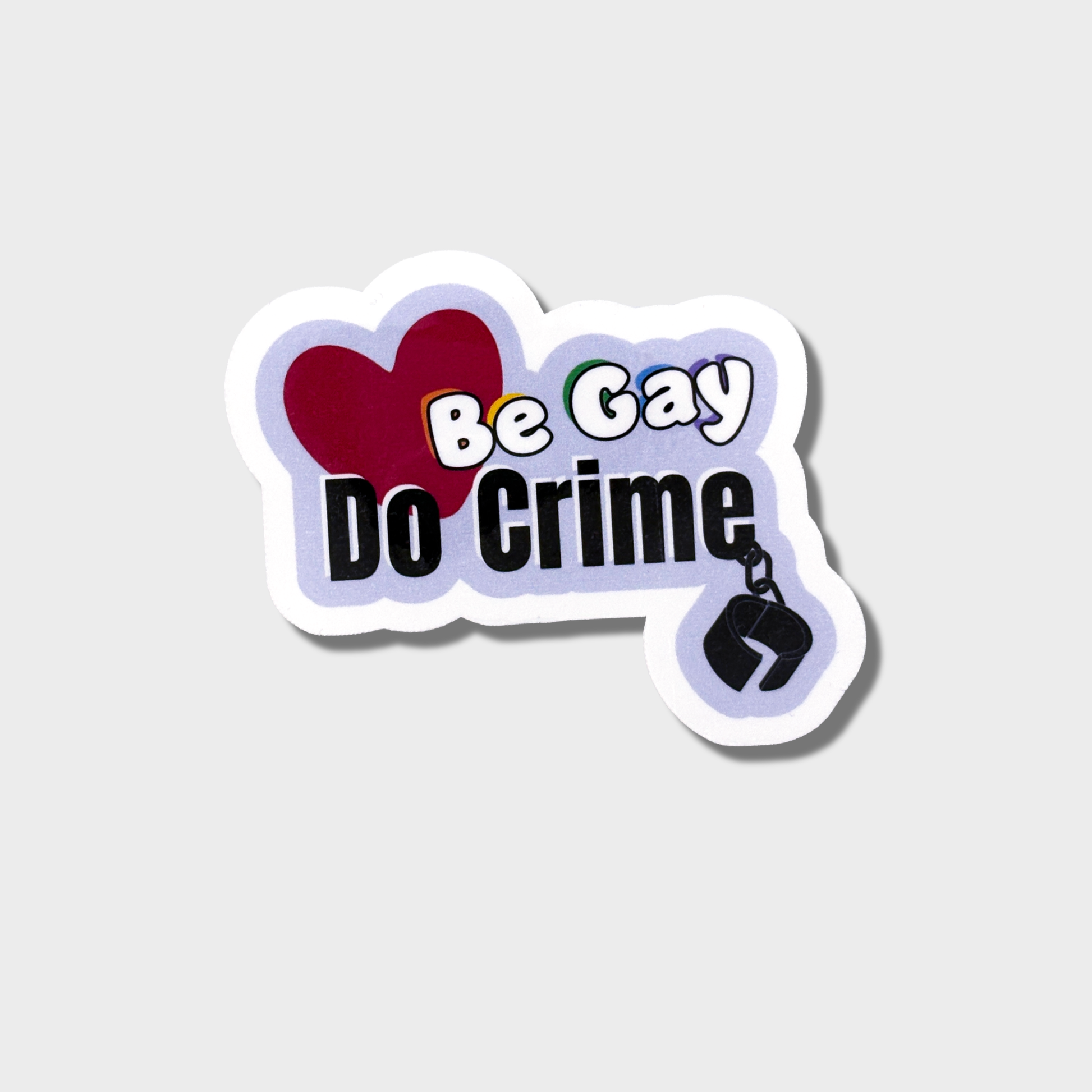 Sticker with text 'Be Gay Do Crime' on a light gray background
