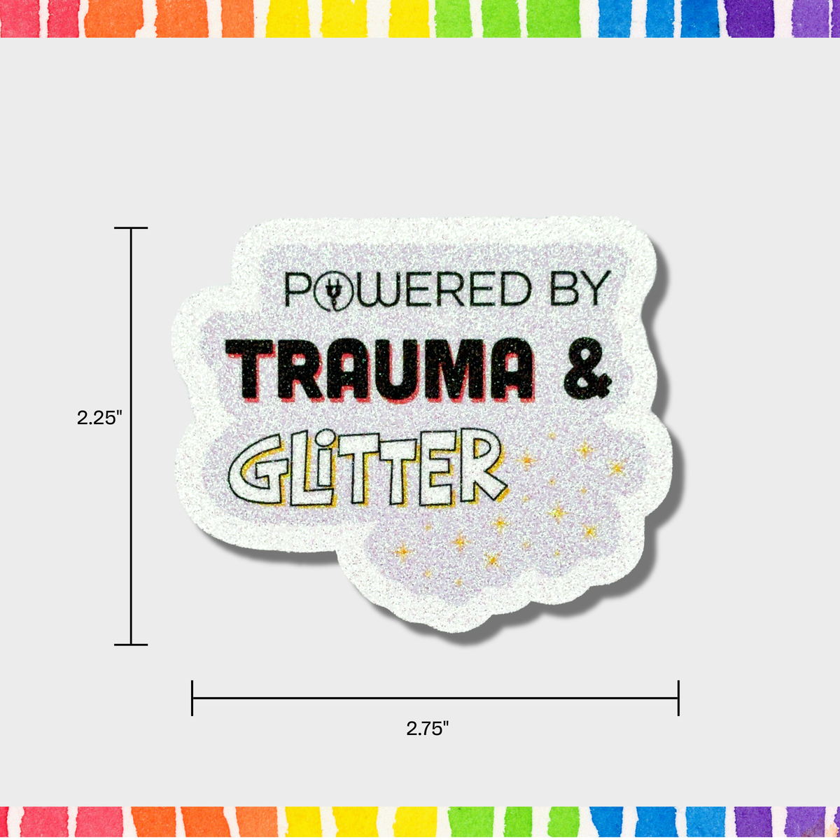Sticker with 'Powered by Trauma & Glitter' text on a white background with measurements 2.25"x2.75".