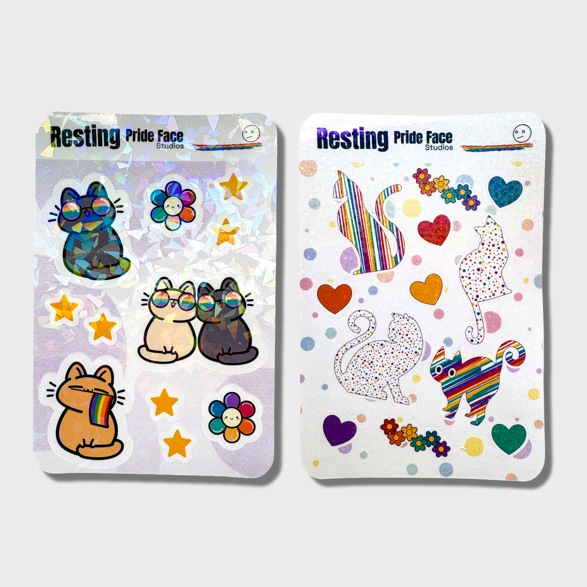 Two of 'Resting Pride Face' sticker sheets with colorful cat designs on a white background.